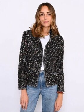Chanel
La Petite Veste Noire tweed blazer